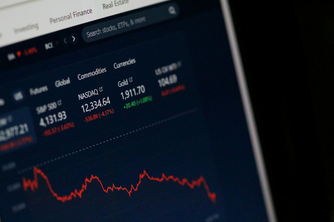 Close-up financial market data screen in a dark professional setting